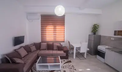 a living room with a couch and a table at Brioni in Virpazar