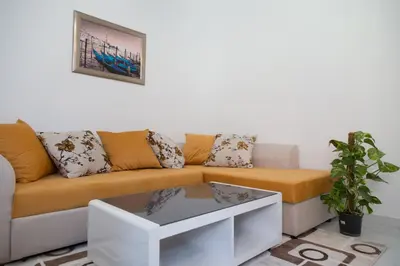 a living room with a couch and a table at Brioni in Virpazar