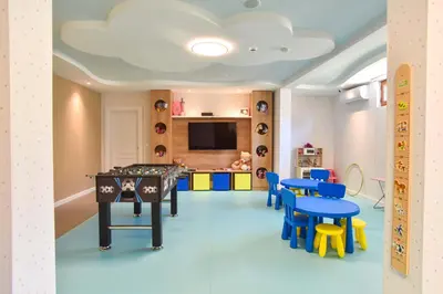 a room with a ping pong table and chairs at Vistamar Hotel & Apartments in Budva