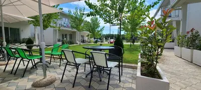 a patio with a table and chairs in a courtyard at Casa Al Mare in Ulcinj