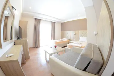 a living room with a couch and a mirror at Casa Al Mare in Ulcinj