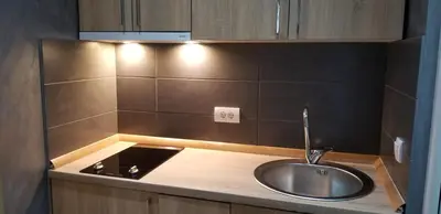 a kitchen counter with a sink and a stove at Casa Al Mare in Ulcinj