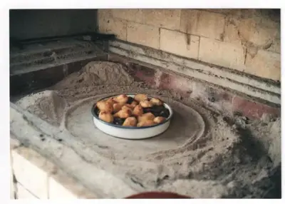 a bowl of food sitting on top of a brick oven at Vacation home in Virpazar