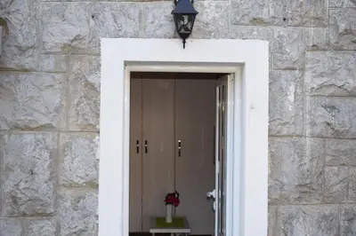 a doorway to a building with a lamp and a vase at OLD TOWN STUDIOS in Budva