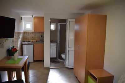 a small kitchen with a sink and a toilet at OLD TOWN STUDIOS in Budva