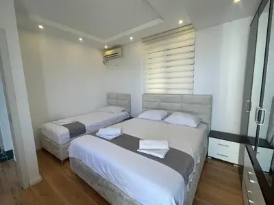 a bedroom with two beds and a window at Days Inn Apartments in Ulcinj