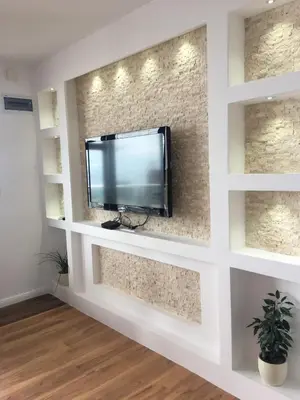 a flat screen tv on a wall in a living room at Days Inn Apartments in Ulcinj
