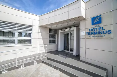 a hotel sign on the side of a building at Hotel Terminus in Podgorica