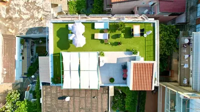 an overhead view of a building with a yard at Guest house Villa Slavica in Sveti Stefan