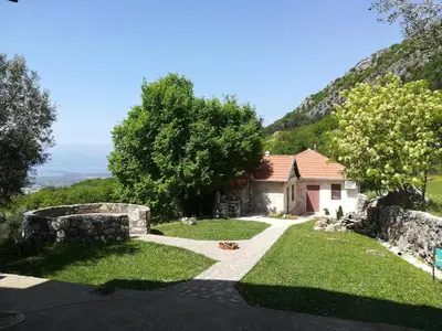 a house on the side of a mountain at Forest Apartments in Kotor