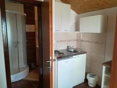 a small bathroom with a sink and a toilet at Forest Apartments in Kotor