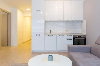 a living room with a couch and a table at Central Budva apartment A10 in Budva