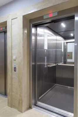 a elevator in a building with a glass door at Central Budva apartment A10 in Budva