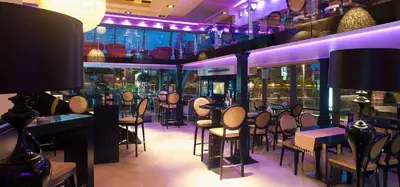 a restaurant with a bunch of tables and chairs at Central Budva apartment A10 in Budva
