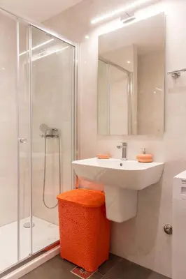 a bathroom with a sink and a shower at Central Budva apartment A10 in Budva