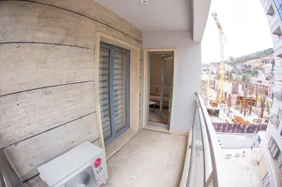 a balcony of a building with a window at Central Budva apartment C15 in Budva