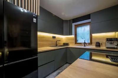 a kitchen with a sink and a microwave at Villa Sun Castle in Kotor