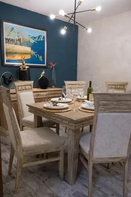 a dining room with a wooden table and chairs at Villa Sun Castle in Kotor