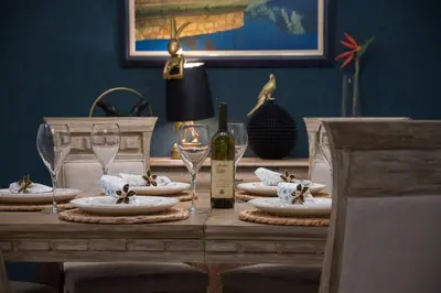 a table with a bottle of wine and glasses on it at Villa Sun Castle in Kotor