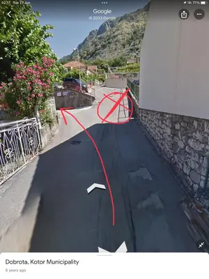 a street with a red line on a road at DC Apartment D in Kotor