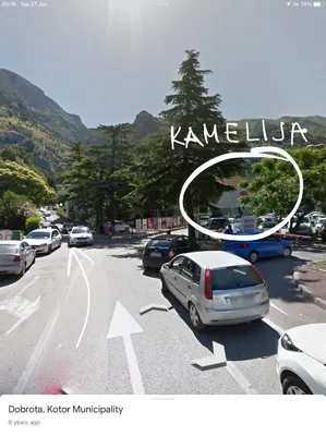 a car is parked on the side of a road at DC Apartment C in Kotor