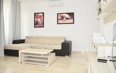 a living room with a couch and a table at Nice Home In Kotor With Sauna in Kotor