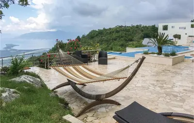 a hammock sitting on the side of a resort at Nice Home In Kotor With Sauna in Kotor