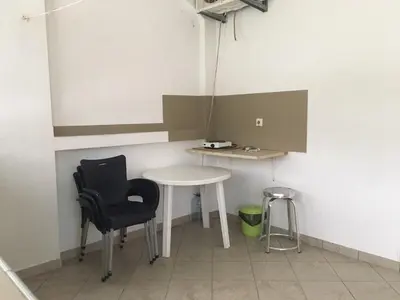 a small room with a table and two chairs at Apartmani Vuković in Sutomore