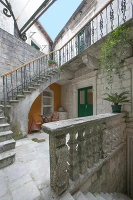 a stone staircase in a building with a stair case at P.S. Cattaro Apartments in Kotor