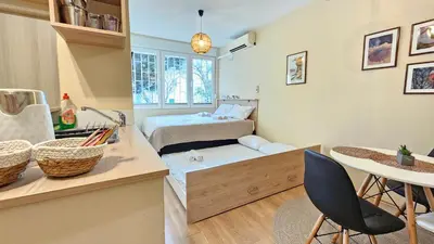 a small room with a bed and a table at Cicki Apartments I - Renovated 2025 in Podgorica