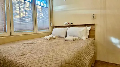 a bedroom with a bed with two stuffed animals on it at Cicki Apartments I - Renovated 2025 in Podgorica