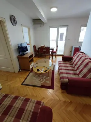 a living room with a couch and a coffee table at Apartman Milica in Budva