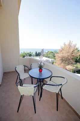 a table and chairs on a balcony with a view at Villa Jupok in Bar
