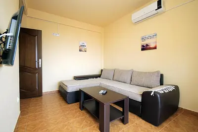 a living room with a couch and a table at Villa Jupok in Bar
