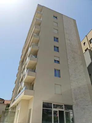 an apartment building with balconies on the side at AS Apartments Budva in Budva
