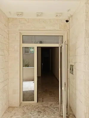 an open door in a room with a hallway at AS Apartments Budva in Budva