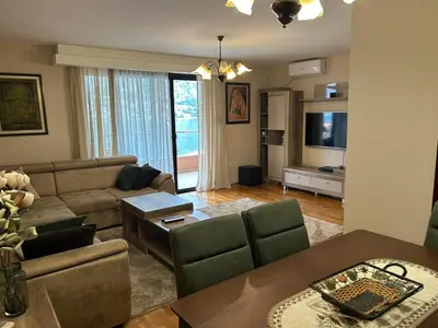 a living room with a couch and a table at Blanka Sea View Apartments in Kotor