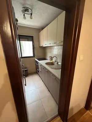 a small kitchen with a sink and a counter at Blanka Sea View Apartments in Kotor
