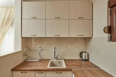 a kitchen with a sink and wooden counter top at Blanka Sea View Apartments in Kotor