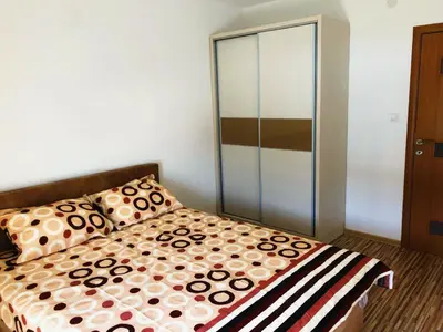 a bedroom with a bed and a glass closet at Vila Jovana in Sutomore