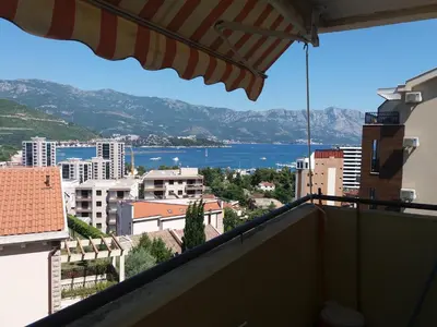 a view of the water from the balcony of a building at Ksenija apartment in Budva