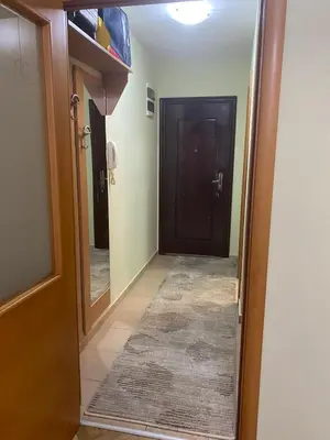a hallway with a door and a mirror at Ksenija apartment in Budva