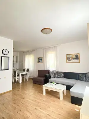 a living room with a couch and a table at Villa Kovacevic in Bar