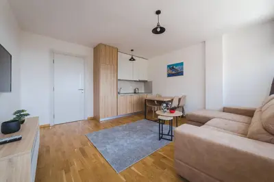 a living room with a couch and a table at Blue Marlin Apartments in Budva