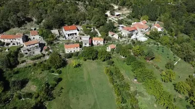 an aerial view of a house on a hill at Rustic Stone House in Bar