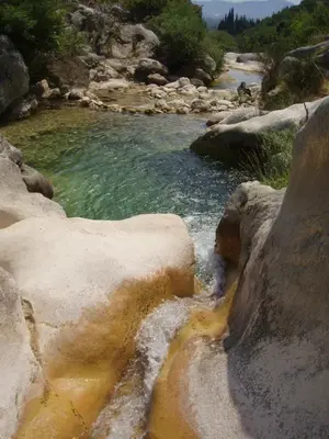 a stream of water with rocks in a river at Rustic Stone House in Bar