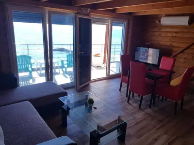 a living room with a couch and a table at Summer Holiday House MM in Ulcinj