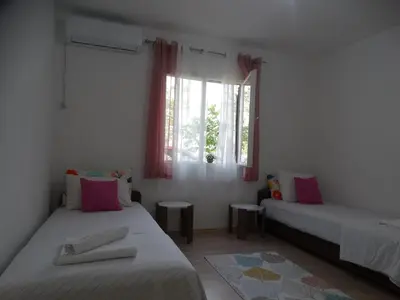 a room with two beds and a window at Apartman Zorana in Bar