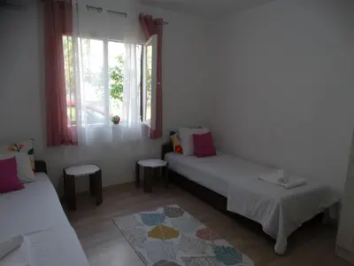 a room with two beds and a window at Apartman Zorana in Bar