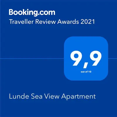 a blue phone screen with a travel review avatar at Lunde Sea View Apartment in Rafailovici